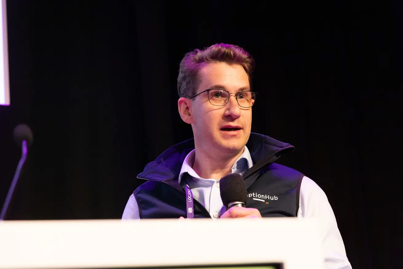 James Jameson speaking at a microphone