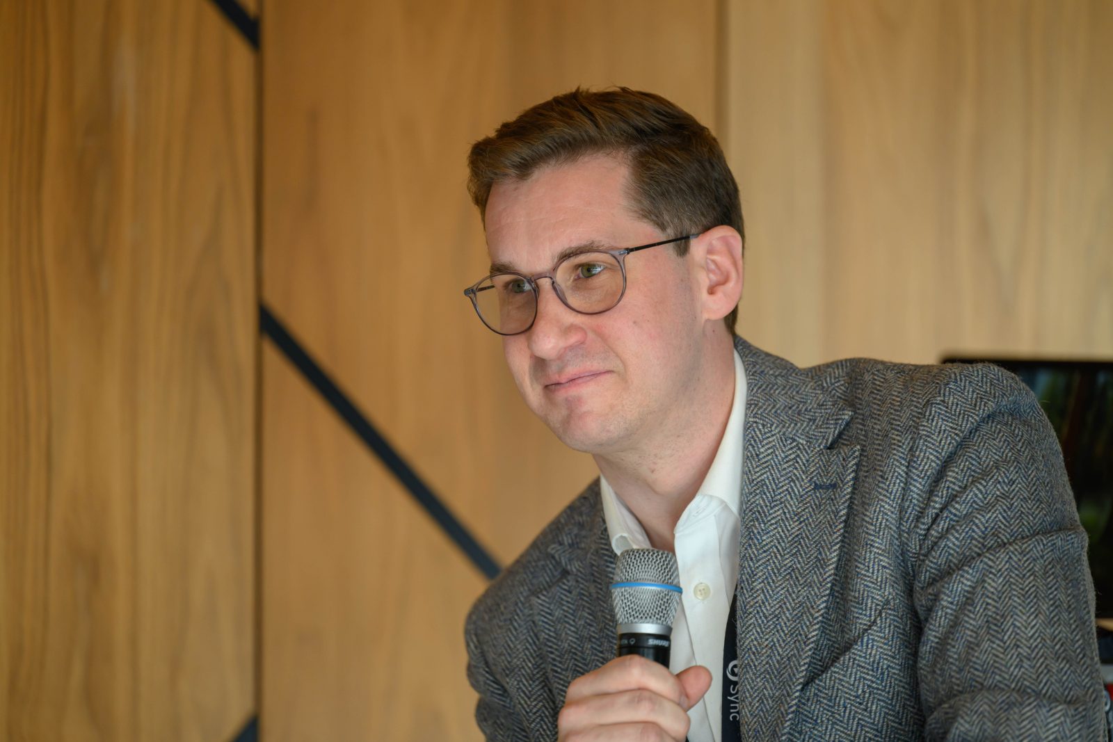 James Jameson speaking with a microphone